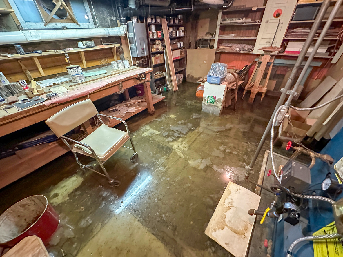 A basement workshop flooded after a major leak requiring the usage of content restoration.